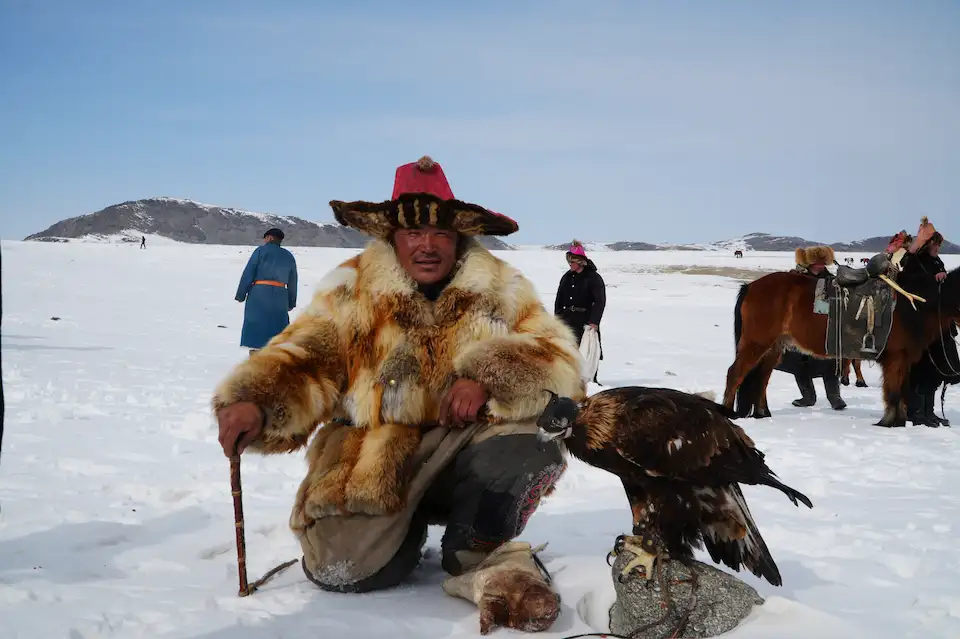 A Kazakh eagle hunter and his golden eagle — captured during Mongolia’s winter migration in the Altai