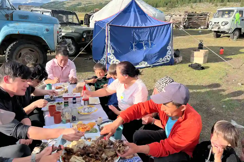 A warm welcome from a nomadic horseman family in Altai Tavan Bogd — celebrating Naadam with shared food and stories