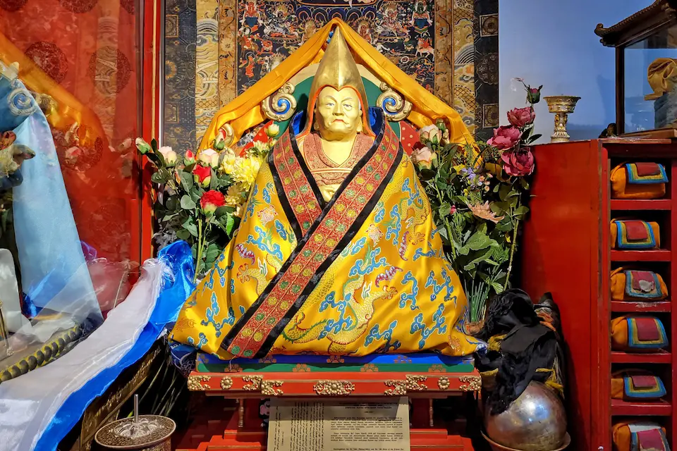 A richly adorned Tibetan Buddhist statue sits in reverence at Erdene Zuu Monastery, showcasing Mongolia’s spiritual craftsmanship.
