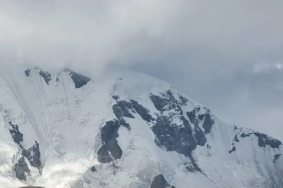 Khüiten Peak veiled in clouds, revealing the dramatic contours of Mongolia’s highest mountain