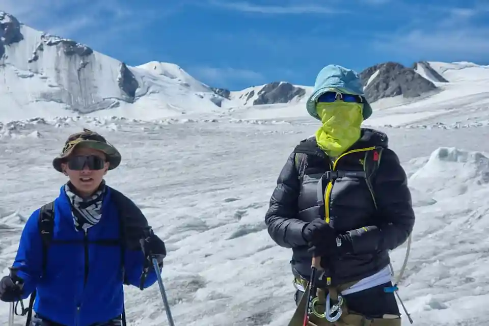 Adventurers trekking across Khüiten Glacier in Mongolia’s Altai Tavan Bogd National Park
