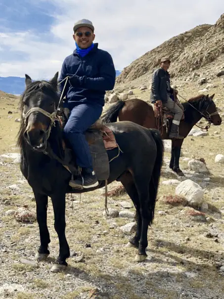Horseback rider enjoying Altai Tavan Bogd’s rocky landscape