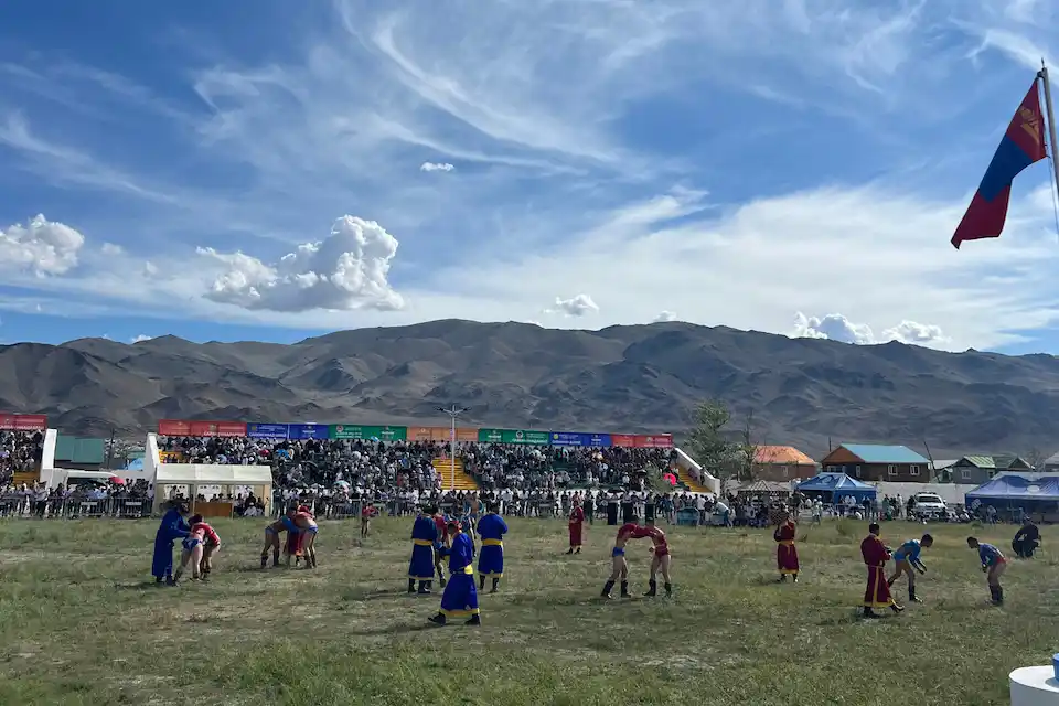 Traditional Mongolian Wrestling at Naadam Festival in Bayan-Ölgii